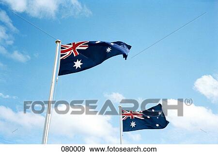 Two Australian flags blowing in the breeze View Large Photo Image Stock Photo - Two Australian flags blowing in the breeze. Fotosearch