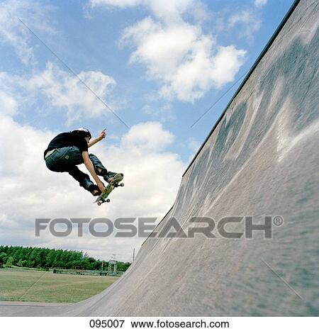 Skateboarder, mid-air View Large Photo Image Stock Photo - Skateboarder, mid-air. Fotosearch