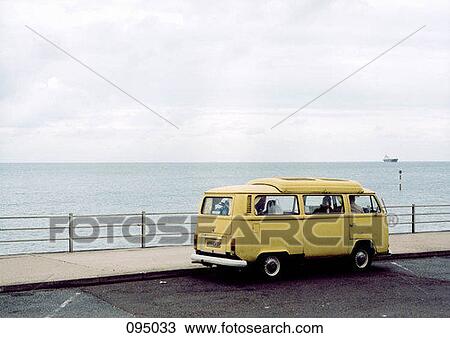 Yellow van parked by sea View Large Photo Image Stock Image - Yellow van parked by sea . Fotosearch
