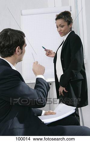 Picture - Businessman and businesswoman in meeting. Fotosearch