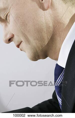 Businessman looking down View Large Photo Image Stock Image - Businessman looking down . Fotosearch