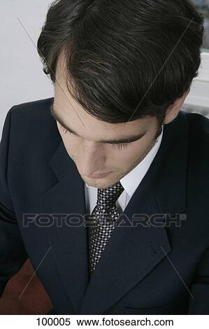 Businessman looking down View Large Photo Image Stock Photography - Businessman looking down. Fotosearch