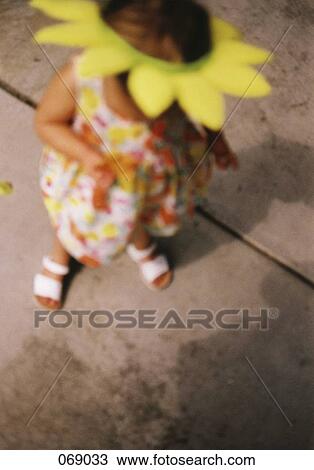 A girl wearing a flower hat View Large Photo Image Stock Image - A girl wearing a flower hat. Fotosearch