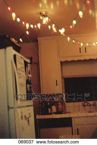 A string of holiday lights in a kitchen View Large Photo Image Stock Photo - A string of holiday lights in a kitchen. Fotosearch