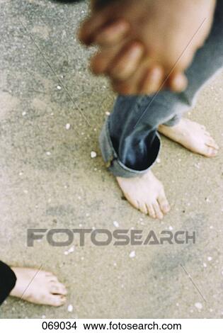 Two people holding hands View Large Photo Image Picture - Two people holding hands. Fotosearch