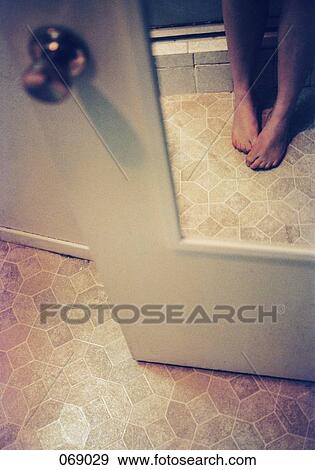 Woman's feet in a bathroom View Large Photo Image Stock Photo - Woman's feet in a bathroom. Fotosearch