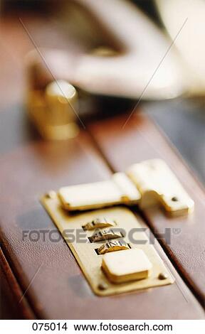 A lock on a briefcase View Large Photo Image Picture - A lock on a briefcase. Fotosearch