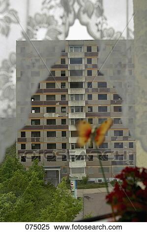 An apartment building through a lace curtain View Large Photo Image Stock Photography - An apartment building through a lace curtain. Fotosearch