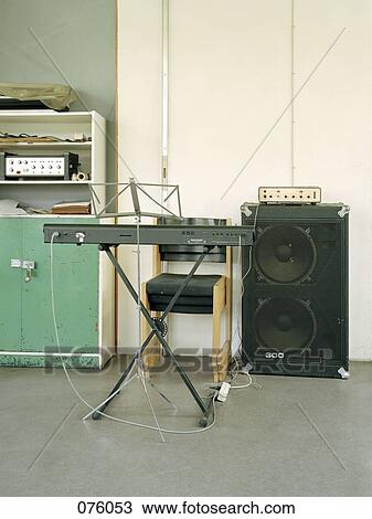 Stock Image - Electronic keyboard and music stand . Fotosearch