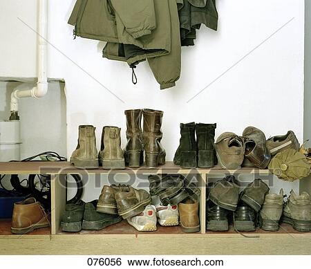 Pairs of shoes stacked on shelves View Large Photo Image Stock Photograph - Pairs of shoes stacked on shelves. Fotosearch