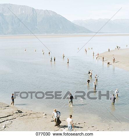 Fishermen wading in water, Alaska, USA View Large Photo Image Stock Image - Fishermen wading in water, Alaska, USA. Fotosearch