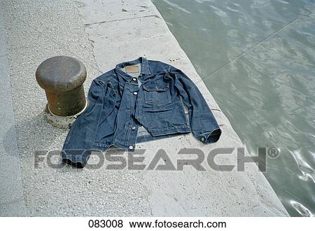 Stock Photo - A denim jacket on the riverbank, Paris, France. Fotosearch