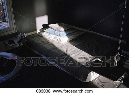 A mattress with pillows in a dark room View Large Photo Image Stock Photo - A mattress with pillows in a dark room . Fotosearch