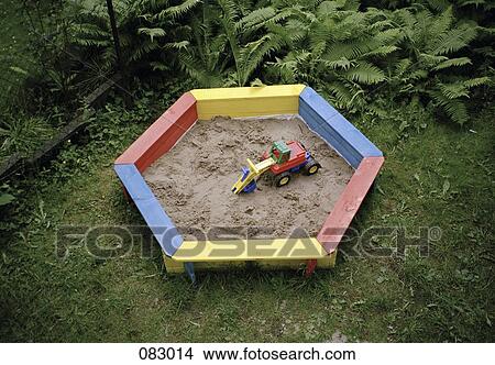 Picture - A toy truck in a sandbox. Fotosearch
