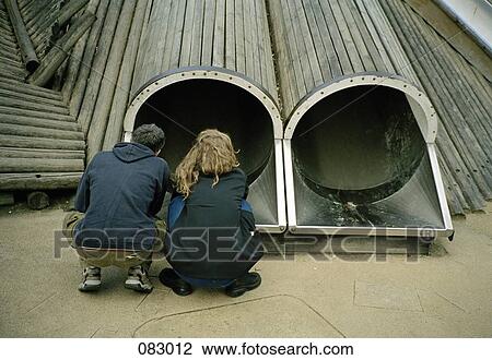 Two people looking into a slide View Large Photo Image Stock Image - Two people looking into a slide. Fotosearch