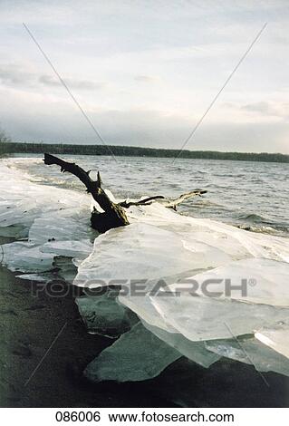 Ice along coastline View Large Photo Image Stock Photograph - Ice along coastline . Fotosearch