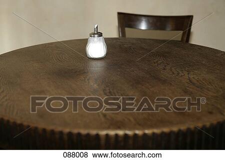 A sugar shaker on a cafe table View Large Photo Image Stock Photo - A sugar shaker on a cafe table. Fotosearch