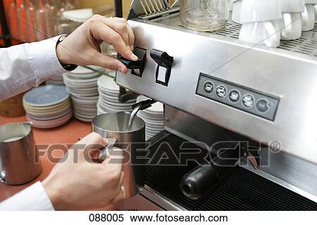Stock Photography - Barista steaming milk. Fotosearch