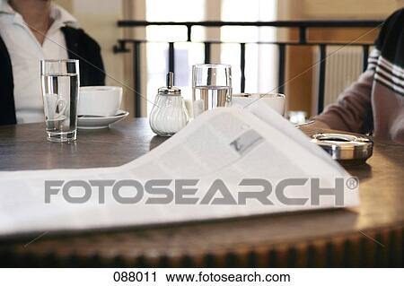 Close-up of newspaper on a cafe table View Large Photo Image Stock Image - Close-up of newspaper on a cafe table. Fotosearch