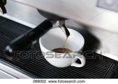 Stock Image - Espresso maker and coffee cup. Fotosearch