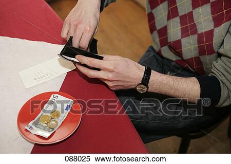 Man paying bill at restaurant View Large Photo Image Stock Photography - Man paying bill at restaurant. Fotosearch