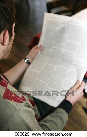 Man reading newspaper in cafe View Large Photo Image Stock Image - Man reading newspaper in cafe. Fotosearch