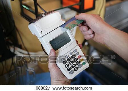 Man using credit card reader View Large Photo Image Stock Photo - Man using credit card reader. Fotosearch