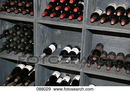Wine bottles in cellar View Large Photo Image Stock Photo - Wine bottles in cellar . Fotosearch