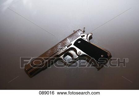 Close-up of a revolver View Large Photo Image Stock Photograph - Close-up of a revolver . Fotosearch