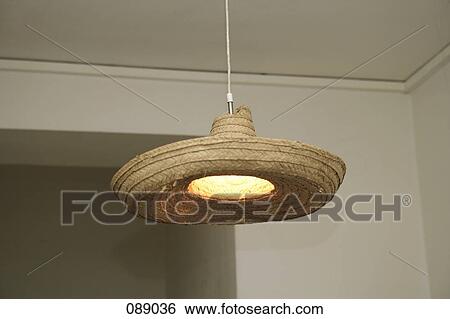 Hanging light decorated with straw hat View Large Photo Image Stock Photograph - Hanging light decorated with straw hat. Fotosearch
