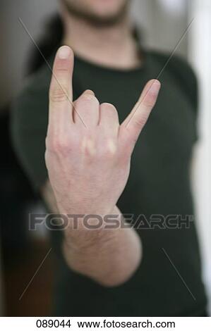 Picture - Man making hand gesture . Fotosearch