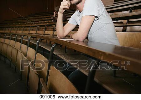 Man sitting in lecture hall View Large Photo Image Stock Photography - Man sitting in lecture hall. Fotosearch