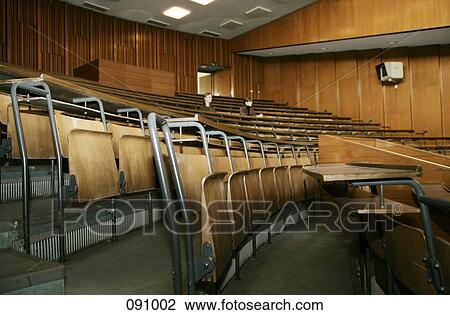 Stock Image - Men sitting in lecture hall. Fotosearch