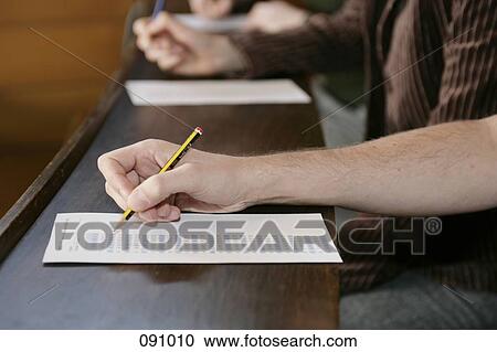 Stock Image - Students taking multiple choice test. Fotosearch