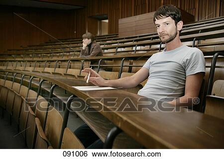 Two men sitting in lecture hall View Large Photo Image Stock Photograph - Two men sitting in lecture hall. Fotosearch