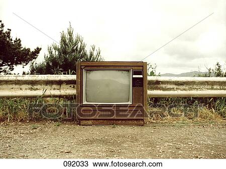 Stock Image - Television on a dirt path. Fotosearch