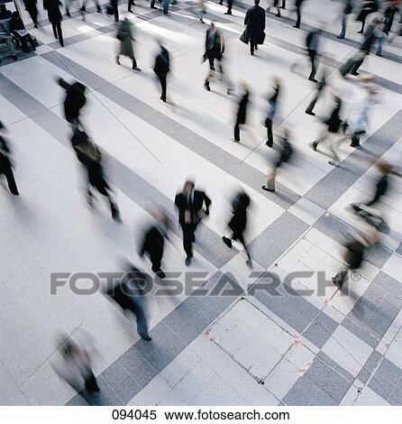 Businesspeople walking through concourse View Large Photo Image Stock Photography - Businesspeople walking through concourse. Fotosearch