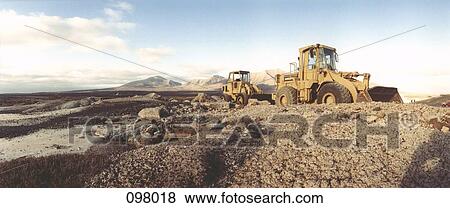 Bulldozers in desert, Canary Islands, Spain View Large Photo Image Stock Photo - Bulldozers in desert, Canary Islands, Spain . Fotosearch