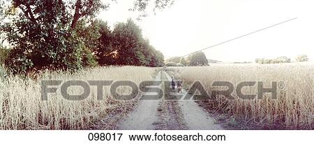 Stock Photo - Children standing on country path, Brandenburg, Germany . Fotosearch