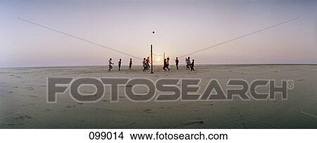 People playing beach volleyball View Large Photo Image Picture - People playing beach volleyball. Fotosearch