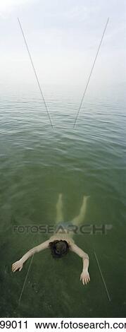 Person floating in ocean View Large Photo Image Stock Image - Person floating in ocean . Fotosearch