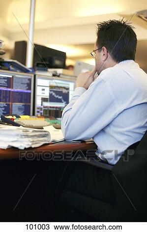 Stock Image - Businessman at desk . Fotosearch