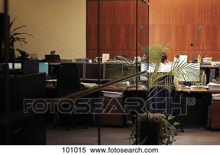 Stock Photography - Businessman sitting in an office. Fotosearch