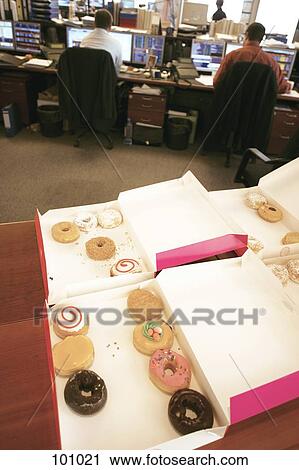 Donut box on an office table View Large Photo Image Stock Image - Donut box on an office table. Fotosearch
