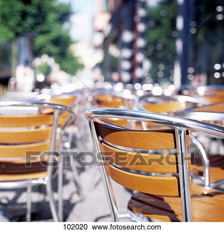 Stock Image - Seating at outdoor cafe. Fotosearch