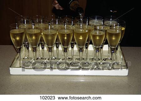 Wine glasses on tray View Large Photo Image Stock Image - Wine glasses on tray. Fotosearch