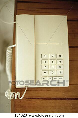 A telephone on a wall View Large Photo Image Stock Image - A telephone on a wall. Fotosearch