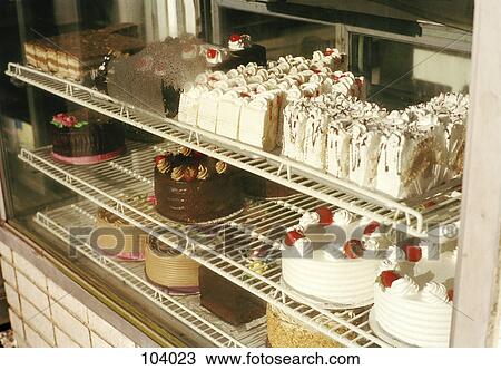 Stock Image - Cakes on display at bakery. Fotosearch