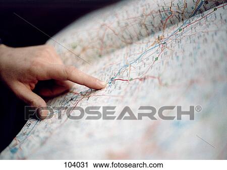 Finger pointing on a map View Large Photo Image Stock Image - Finger pointing on a map. Fotosearch