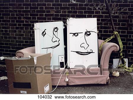 Stock Image - Two faces drawn on refrigerators. Fotosearch